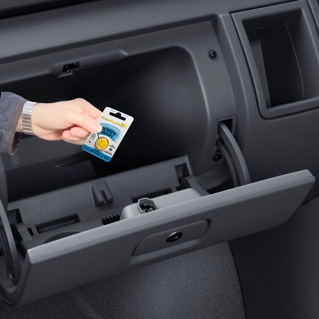 Compact screen wash tablet pack being held in a car with an open drawer, showing easy storage